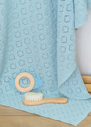 Little dino luxury baby gift set with blue knit blanket dino teether and soft brush
