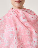 Close-up of Florielle linen scarf showing botanical print and self fringes