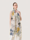 Spring Foliage cotton silk scarf worn long in front, showing mustard yellow and slate blue botanical print